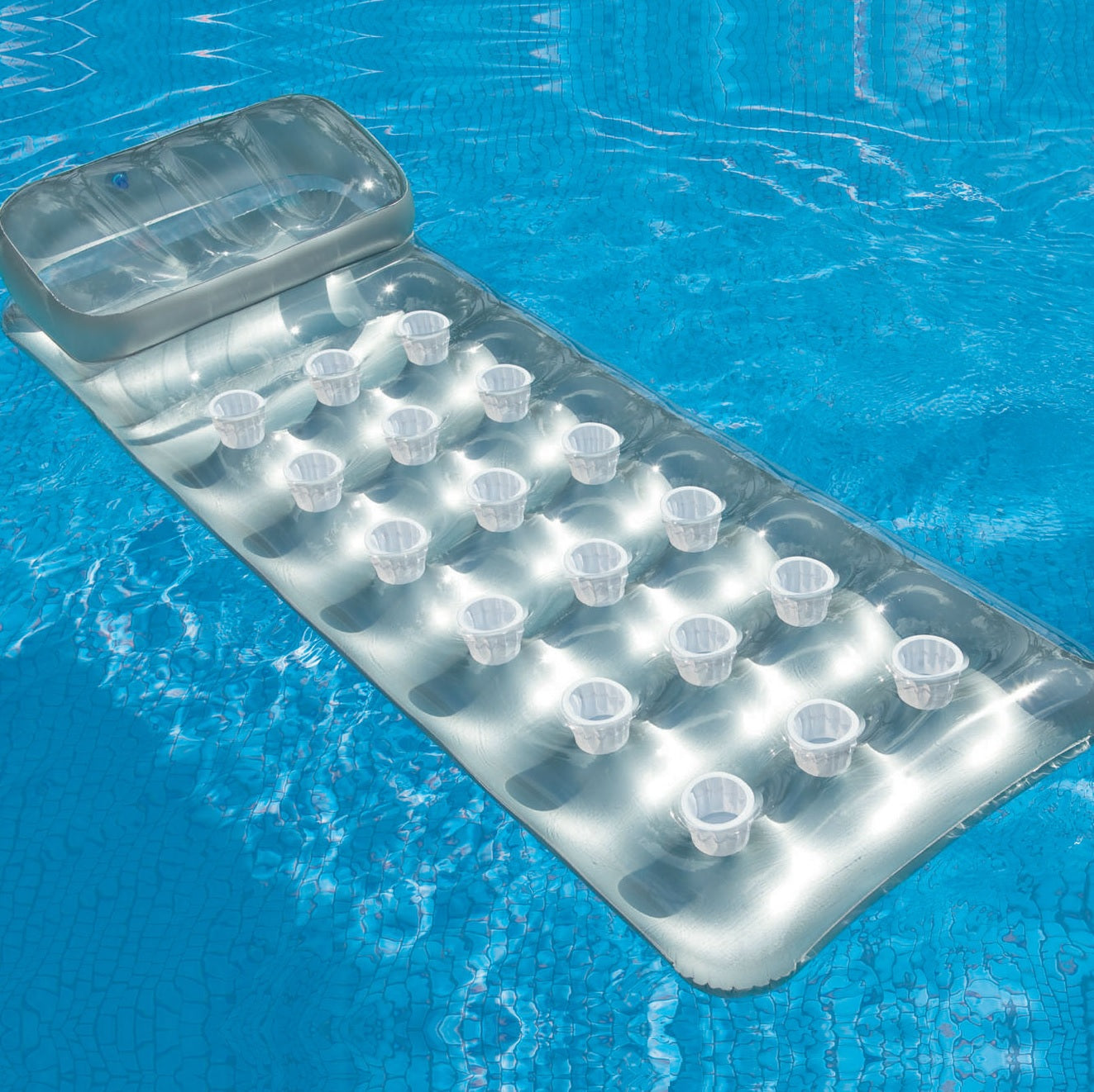 Silver inflatable pool mattress.