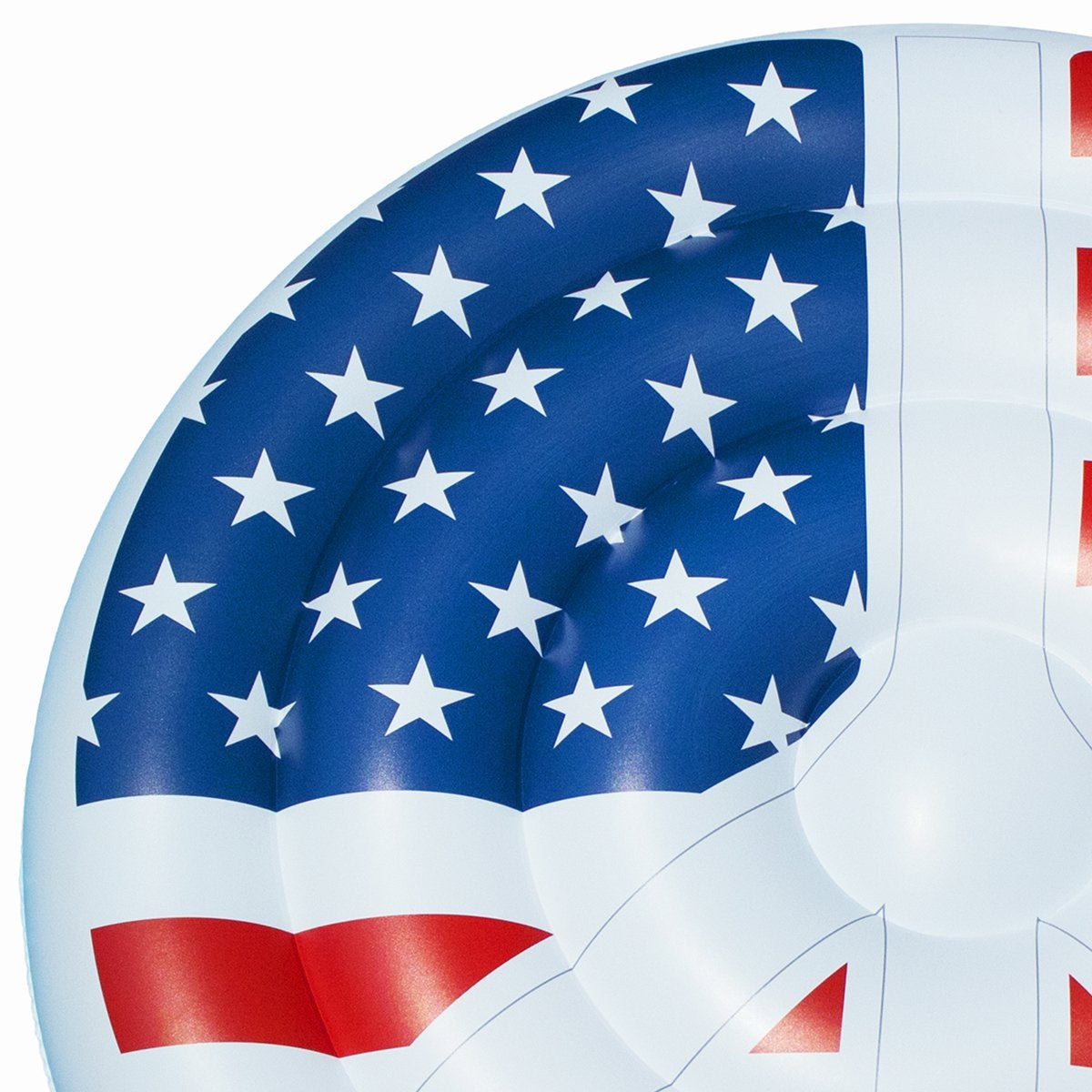 A pool float designed to look like a peace sign made out of the American flag.