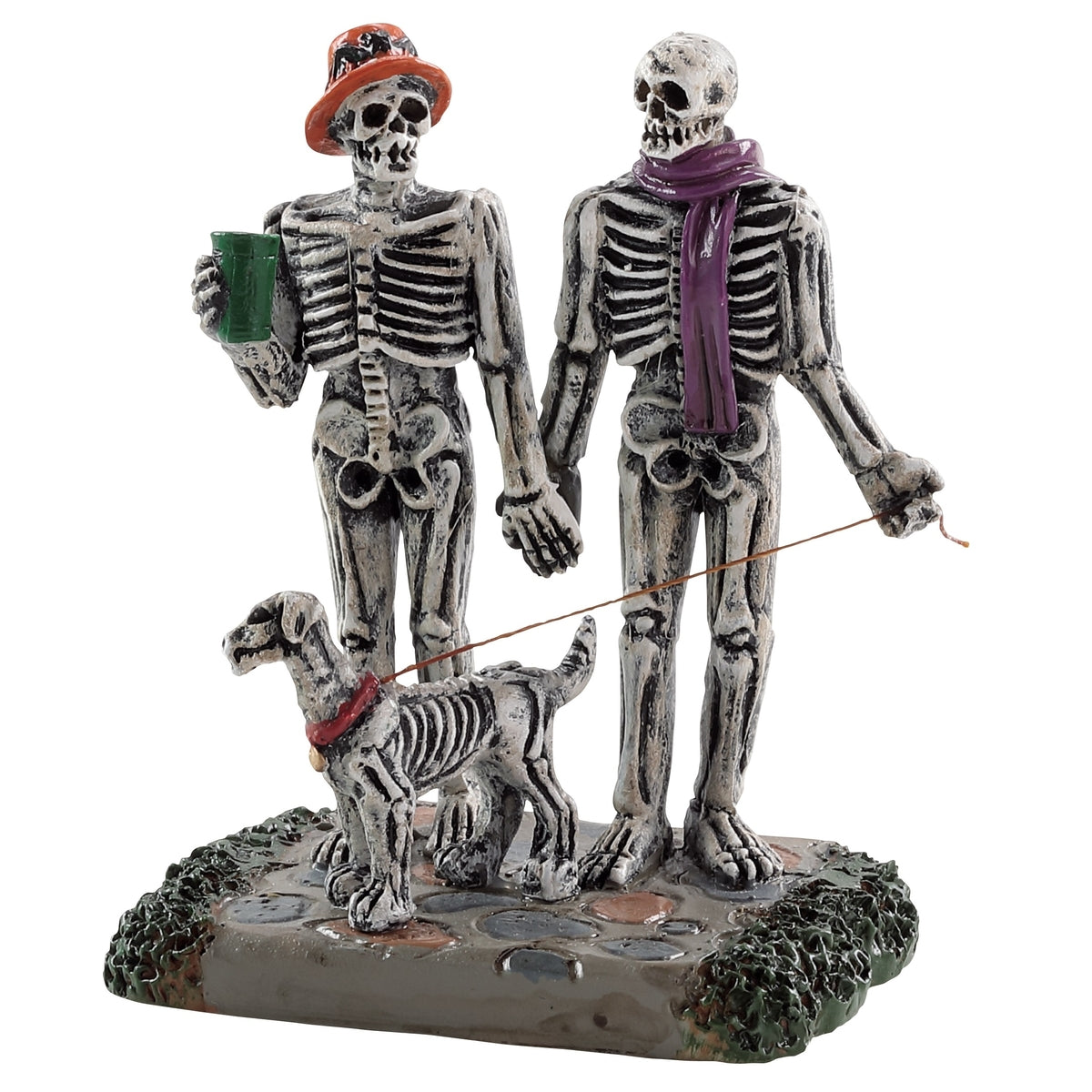 Polyresin figurine for a Lemax display. Designed to look like a skeleton couple out for a walk with their skeleton dog. They're holding hands.