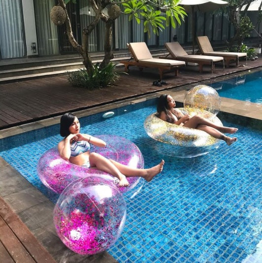Clear inflatable inner tube with glitter inside. There are two glitter options: gold or purple.