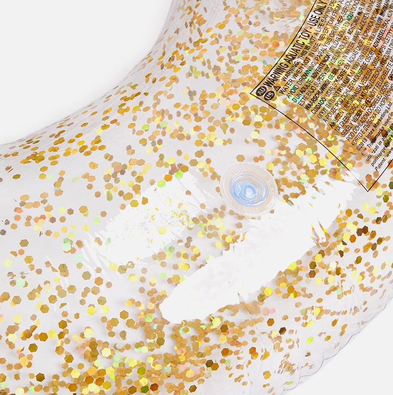 Clear inflatable inner tube with glitter inside. This tube has gold glitter.