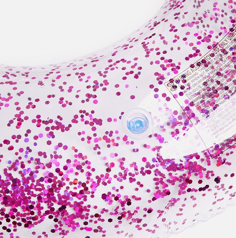 Clear inflatable inner tube with glitter inside. This tube has purple glitter.