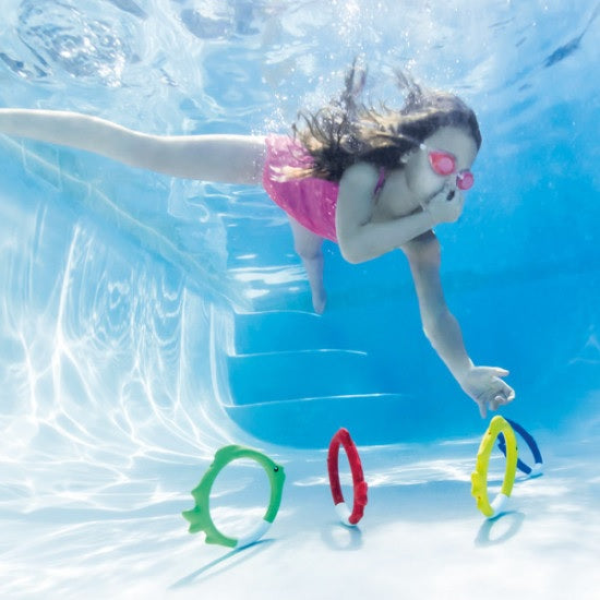 Set of diving toys that are shaped like circular fish.