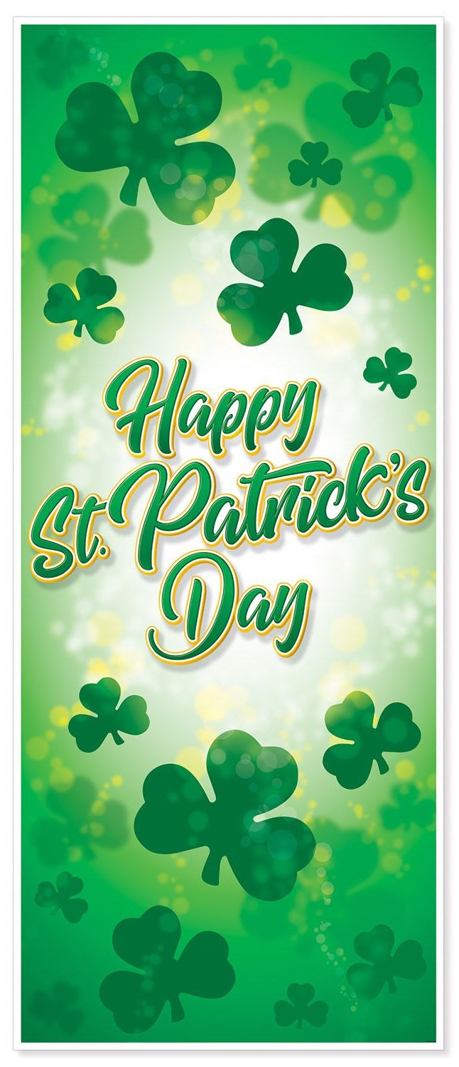Decoration you hang on a door. The door cover is different shades of green with different sized shamrocks. There are specks of yellow. In green and yellow cursive it reads "HAPPY ST. PATRICK'S DAY!"