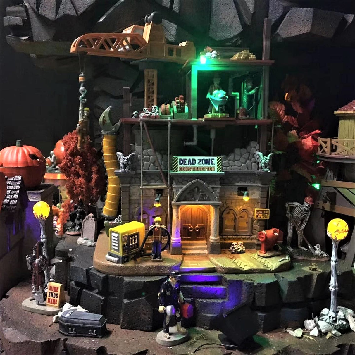 Polyresin village accent for a Lemax Spooky Town display. Designed to look like a construction site. A bunch of monster-construction workers are building, what looks to be a cathedral with gargoyles on the sides.