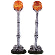 Polyresin village accents for a Lemax display. Designed to look like two lampposts made of bones and skulls. The lights look like carved pumpkins.