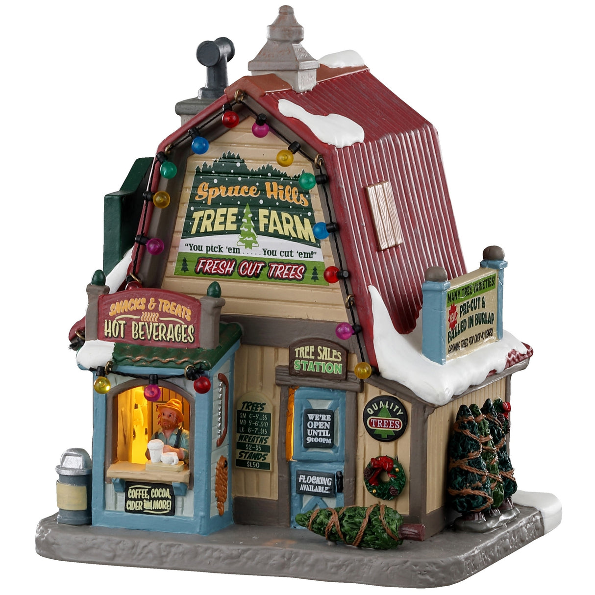 Porcelain lighted building for a Lemax Village tabletop display. It reads "Spruce Hills Tree Farm. Fresh cut trees." It's covered in snow and has multi-colored lights on it. There are a few wrapped up trees on the side and a person at the front booth serving beverages.