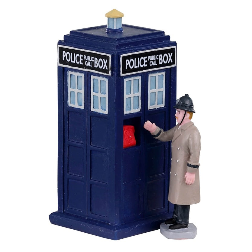 Polyresin figurine for a Lemax Village tabletop display. Designed to look like a blue Public Call Police Box with an officer wearing a brown coat standing next to it