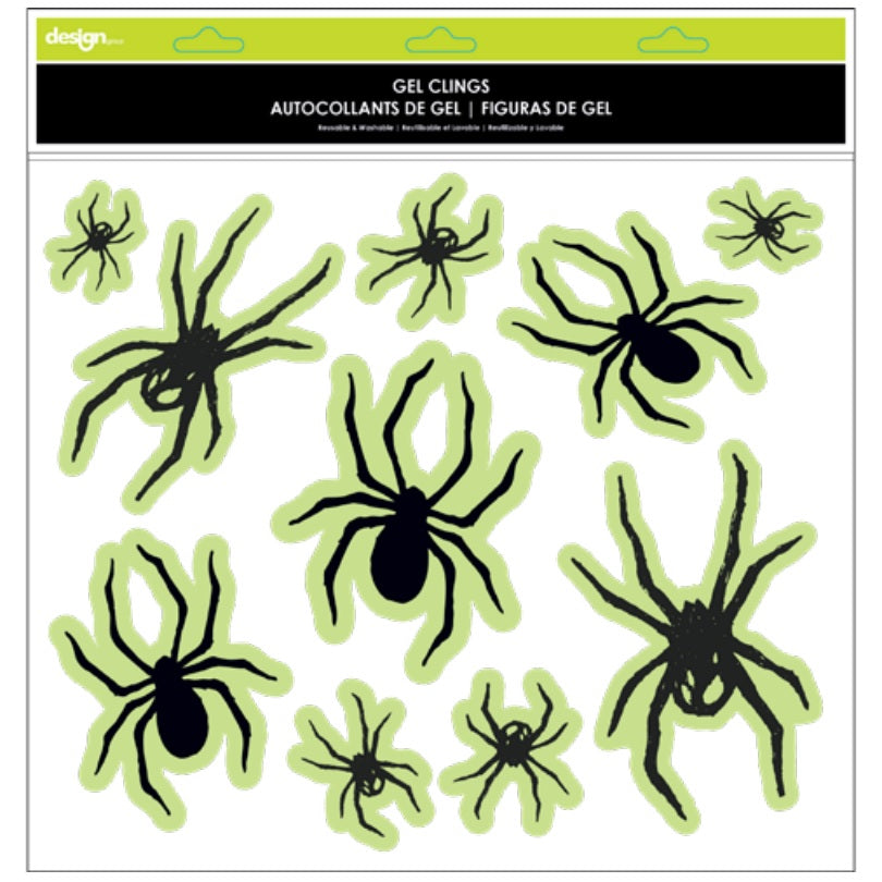 Glow in the dark window cling decorations for Halloween. One set reads "Happy Halloween" and features jack-o-lanterns and stars. One set features a bunch of different sized spiders. One set features a skull and cross bones with lightning. One set reads "Trick or Treat."