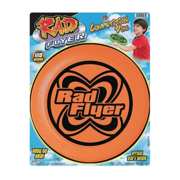This picture shows the orange frisbee inside the packaging. It shows a boy getting ready to throw it and it reads "competition disc." At the bottom of the packaging, it reads "Easy to grip" on the left side and it reads "Official size and weight" on the right side.