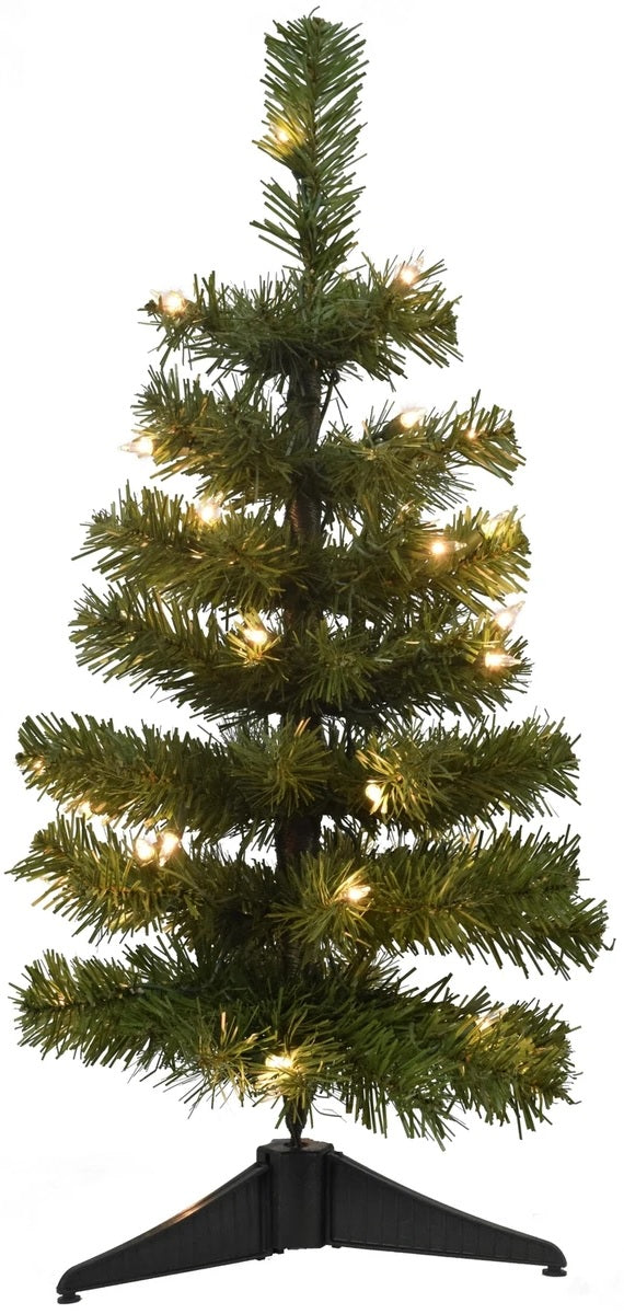 Small tabletop artificial tree decorated with clear lights.