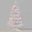 Small white tree pre-lit with multi-colored lights.