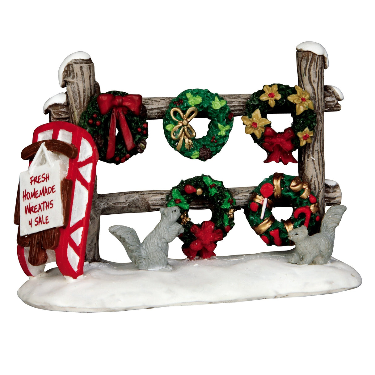 Polyresin figurine for a Lemax display. Designed to look like a rustic, wooden fence with snow on it. There are decorated wreaths for sale. There are two squirrels and a red sled.