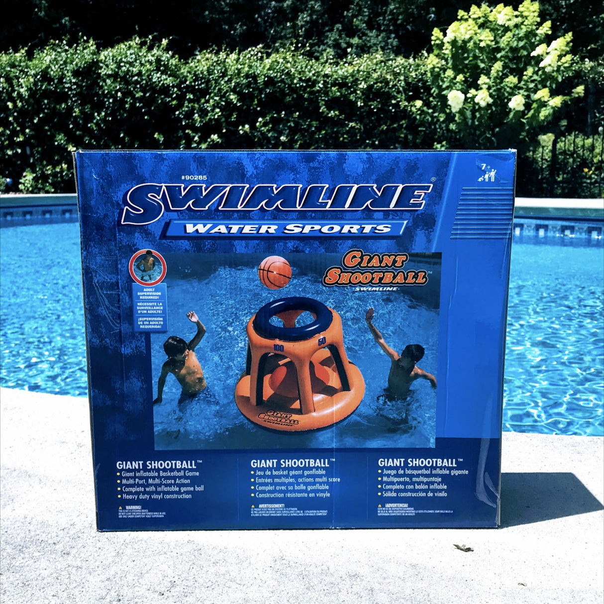 Pool inflatable shaped like a blue and orange basketball hoop.