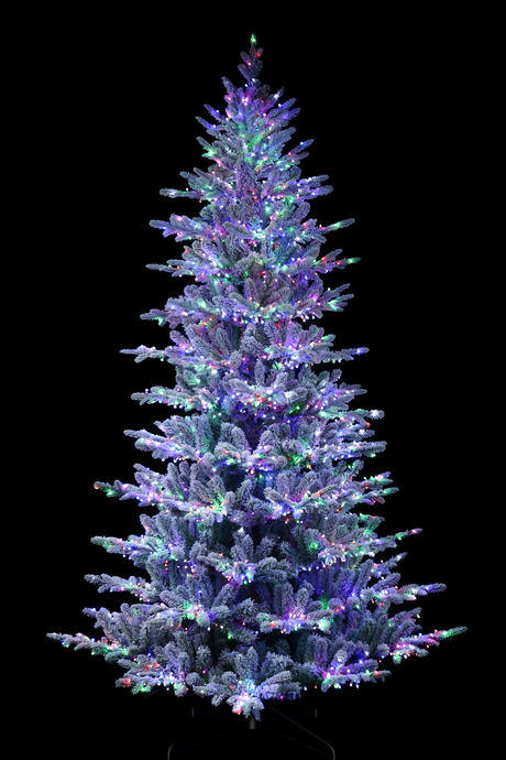 Artificial tree pre-lit with Starry lights. Branches are covered in white to appear covered in snow.