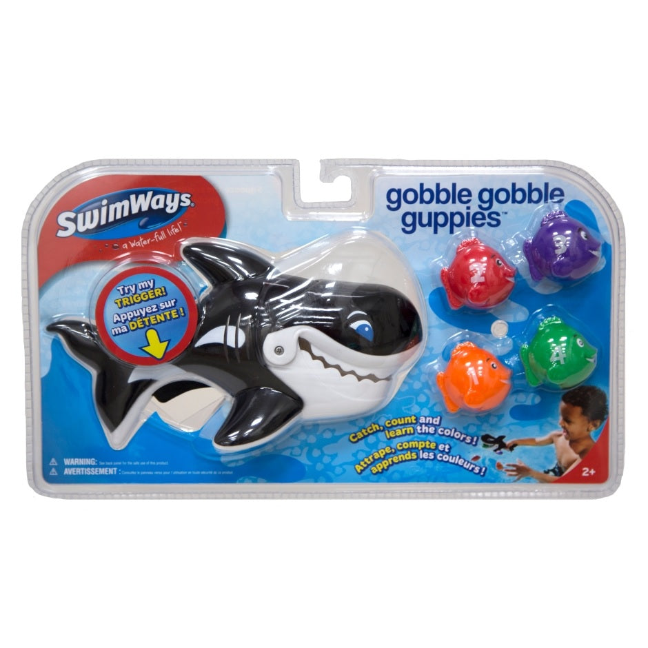 Pool game shaped like a whale whose mouth opens up. Kids try to use the whale's mouth to swallow up the little toy fish.