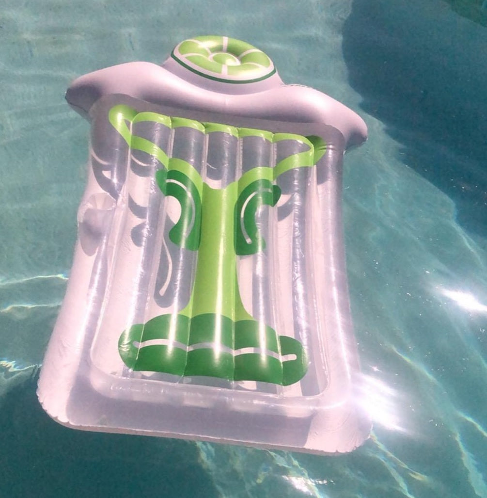 Pool float lounger shaped like a martini glass with a lime on top.