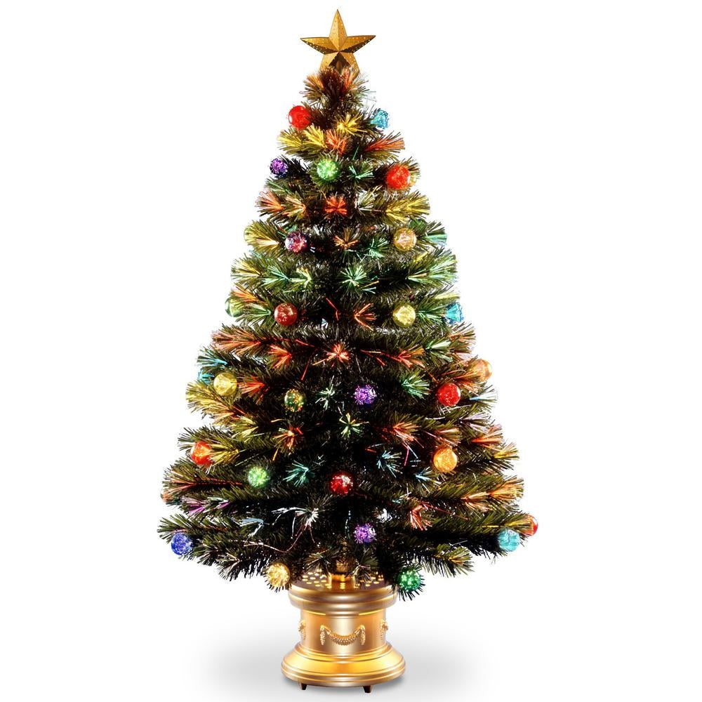 Fiber optic tree with multi-colored ornaments on it and a star up top.