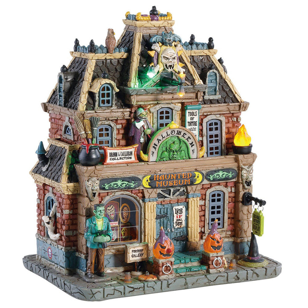 Porcelain building for a Lemax display. Designed to look like a brick museum accented with owls, flames, carved pumpkins, witch hats, ghosts and Frankenstein.