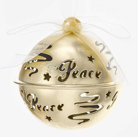 Gold bell ornament. There are swirl cutouts and a cutout that reads "PEACE."