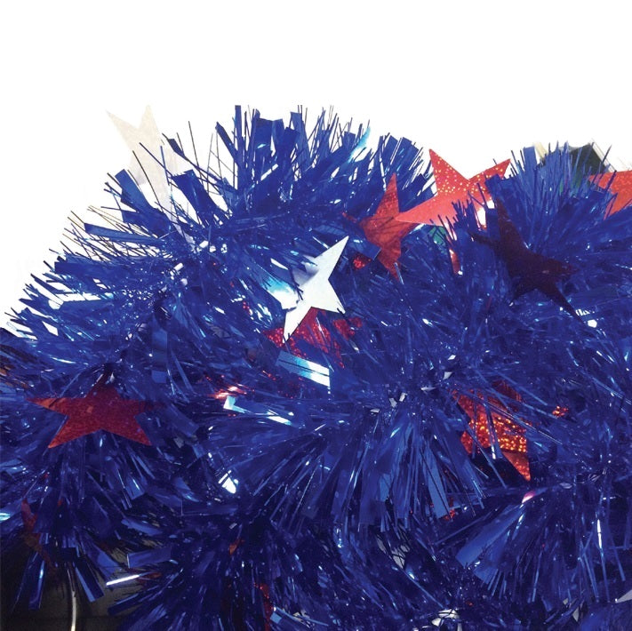 Blue decorating tinsel with red and white tinsel stars.