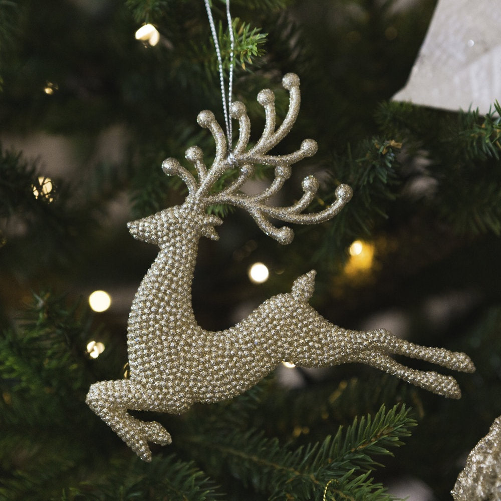 Gold ornaments shaped like reindeer.