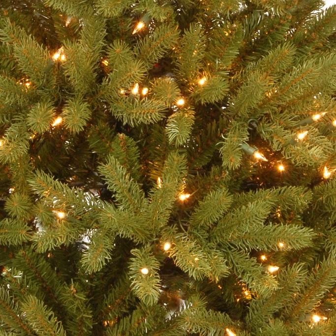 Artificial tree pre-lit with clear lights.