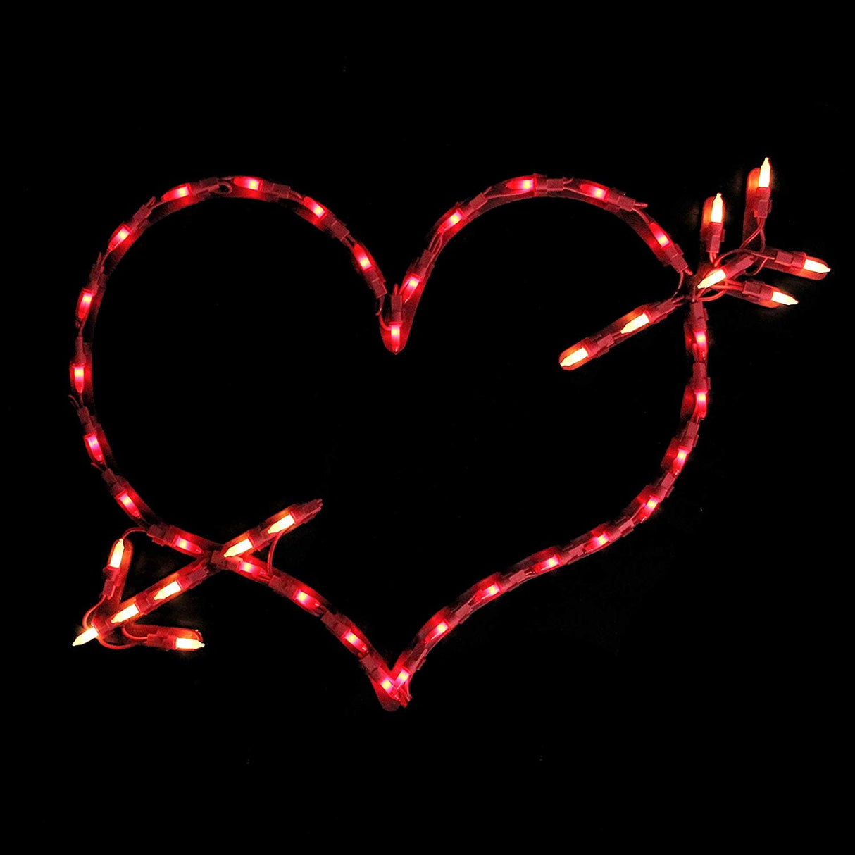 Lighted silhouette decoration shaped like a heart with an arrow through it.