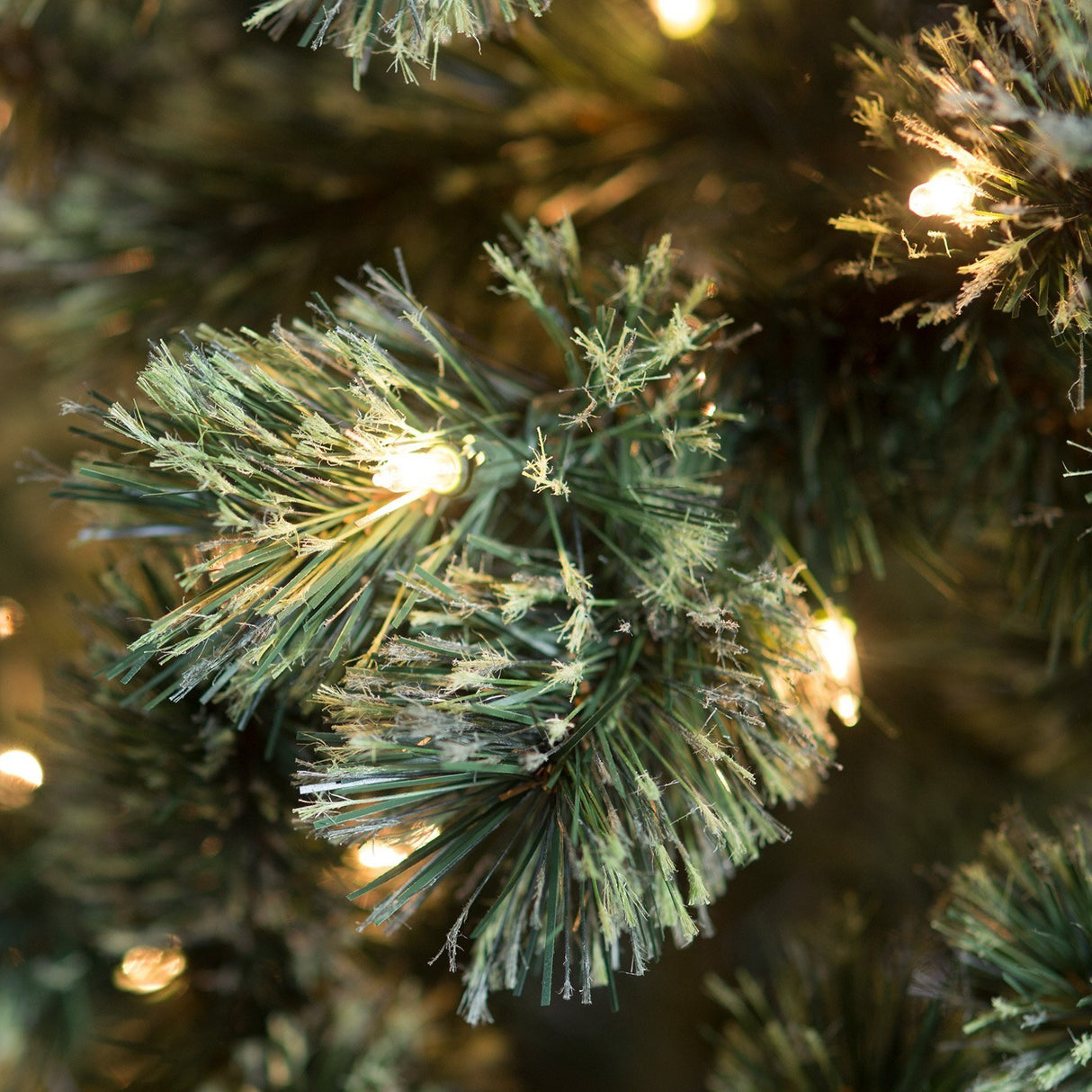 Pre-lit artificial tree. Lights are clear.