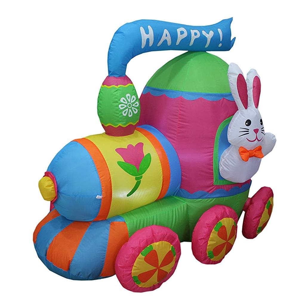 An inflatable train yard decoration. It's light blue, pink, lime green, white, orange and yellow. It features a bunny hanging out the window and it reads "HAPPY!"