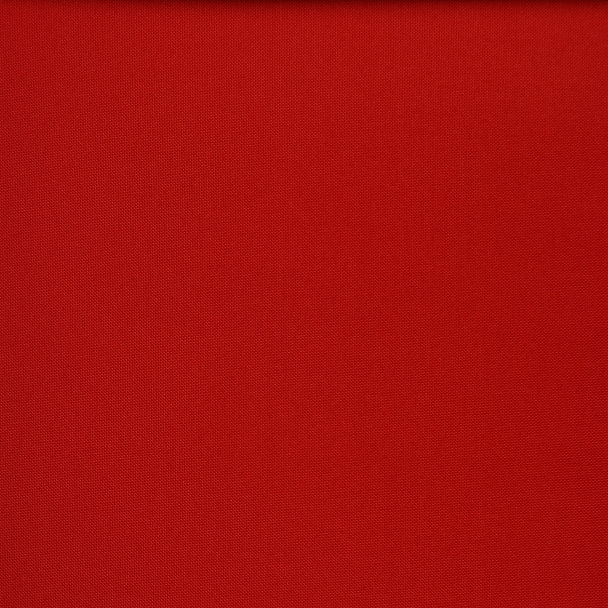 Close up of the red folding chair fabric.