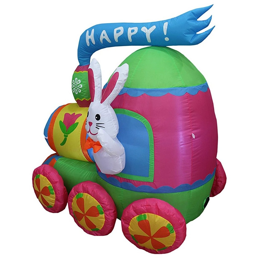 An inflatable train yard decoration. It's light blue, pink, lime green, white, orange and yellow. It features a bunny hanging out the window and it reads "HAPPY!"
