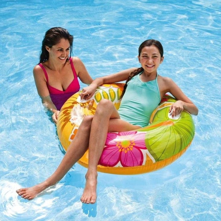 Inner tube detailed with pink flowers and green leaves.