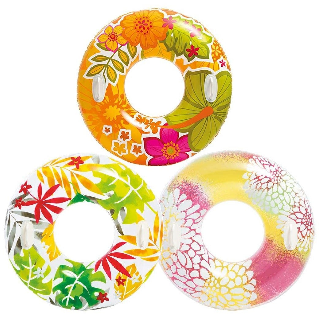 Colorful inner tubes. One has colorful flowers, one has tropical leaves and one has pink and yellow leaves.