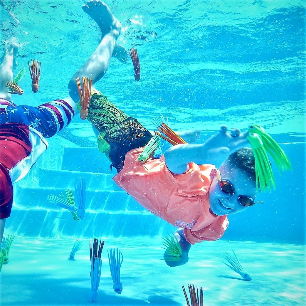 Pool dive toy shaped like an octopus. They're multi-colored and have cute, smiling faces.