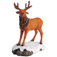 Polyresin figurine for a Lemax display. Designed to look like a deer standing on stones covered in snow.