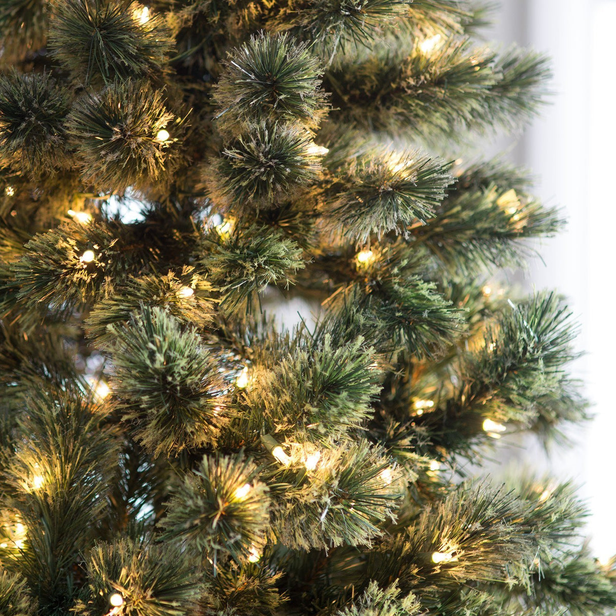 Pre-lit artificial tree. Lights are clear.