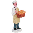 Polyresin figurine for a Lemax display. Designed to look like a chef carrying a bread delivery in a basket around his neck.