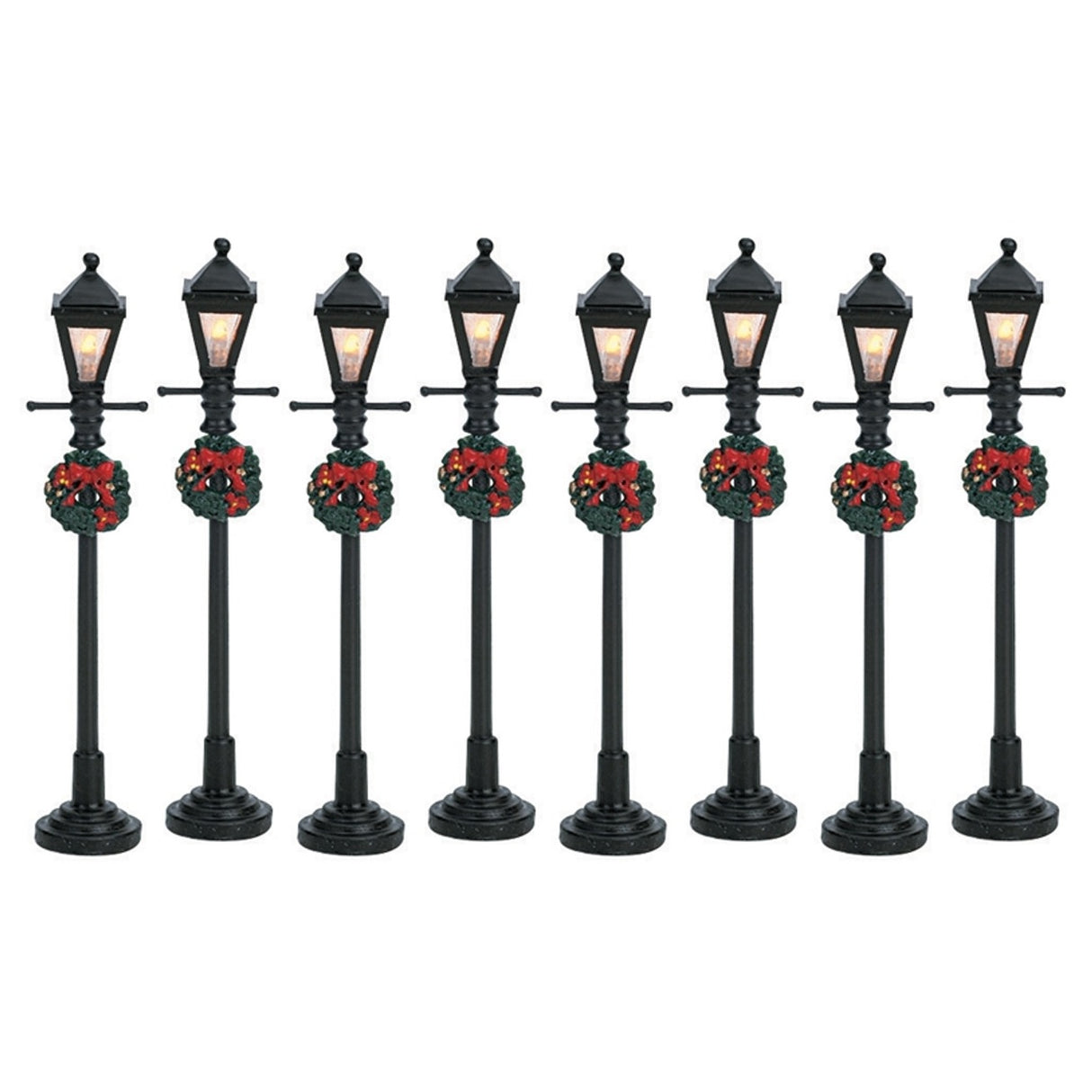 Set of 8 Lemax village lampposts. Each is decorated with a Christmas wreath.