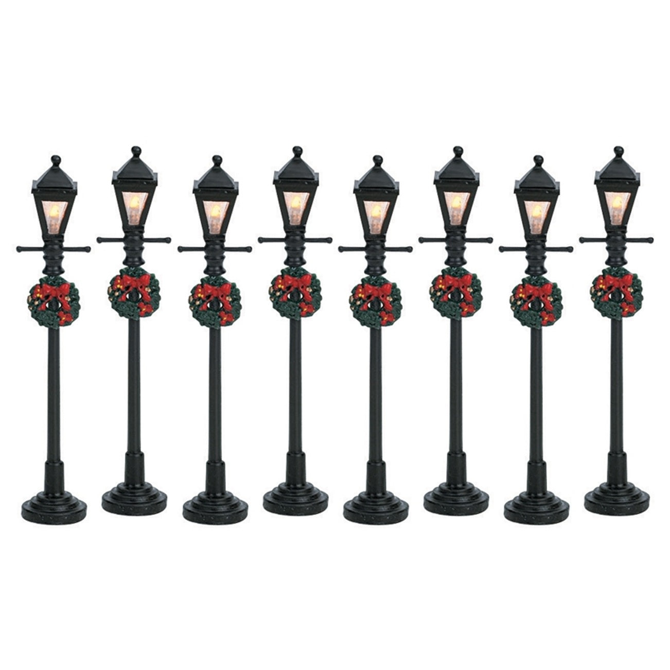 Set of 8 Lemax village lampposts. Each is decorated with a Christmas wreath.