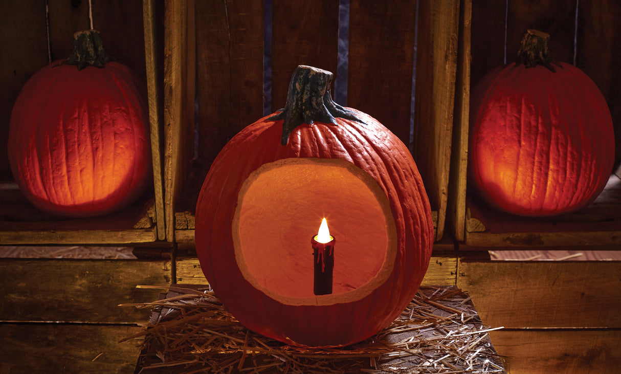 Battery-operated black candle with red wax dripping off the top. Designed to be placed inside a pumpkin/jack-o-lantern.