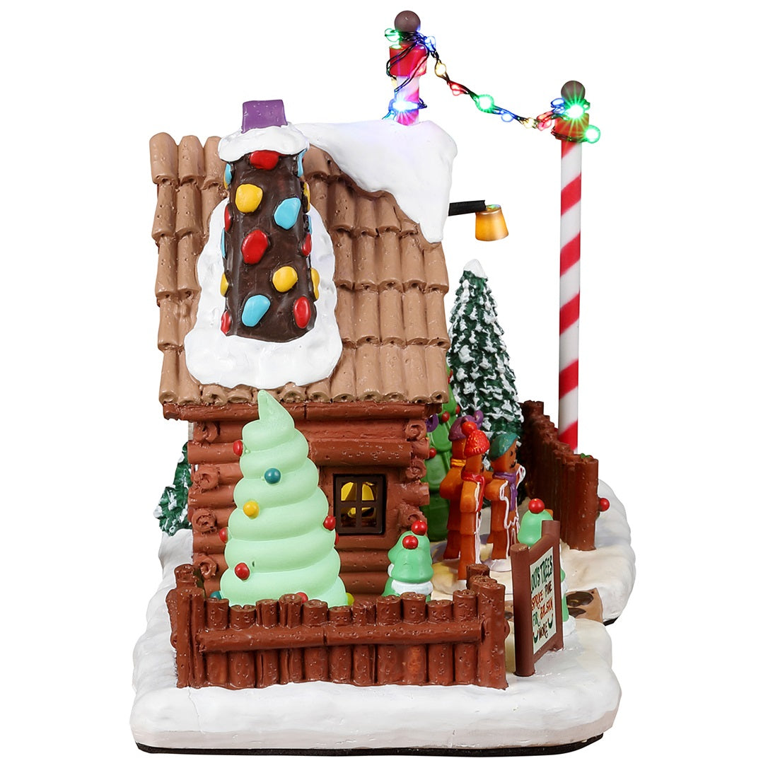 Resin lighted building for a Lemax display. Designed to look like a tree farm where you can choose your favorite tree. Everything appears to be made of candy, gingerbread and frosting.