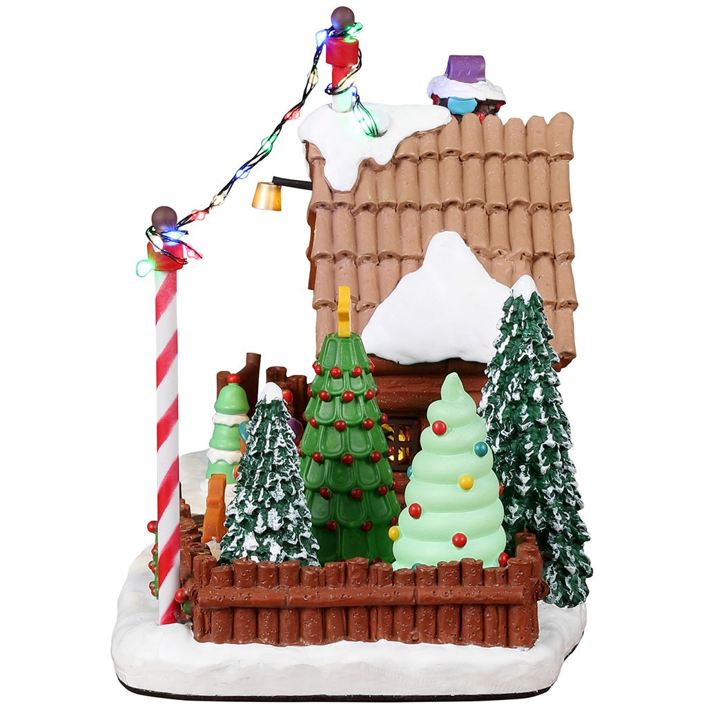 Resin lighted building for a Lemax display. Designed to look like a tree farm where you can choose your favorite tree. Everything appears to be made of candy, gingerbread and frosting.