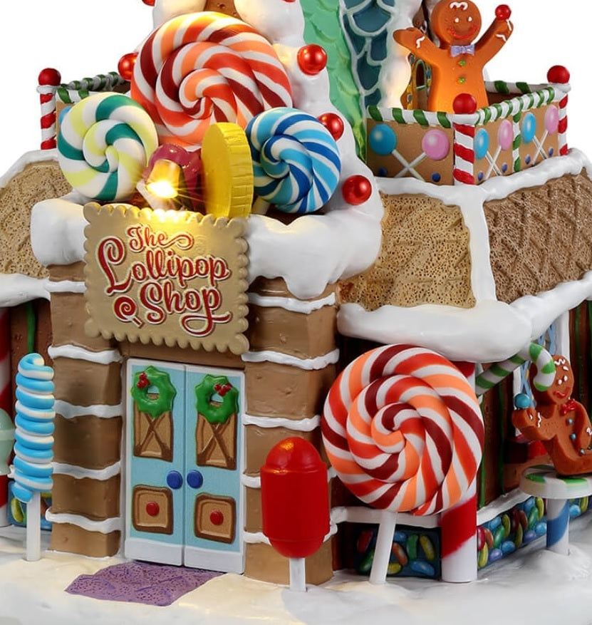 Resin lighted building for a Lemax display. Designed to look like a candy shop made out of gingerbread, candy, frosting and lollipops.