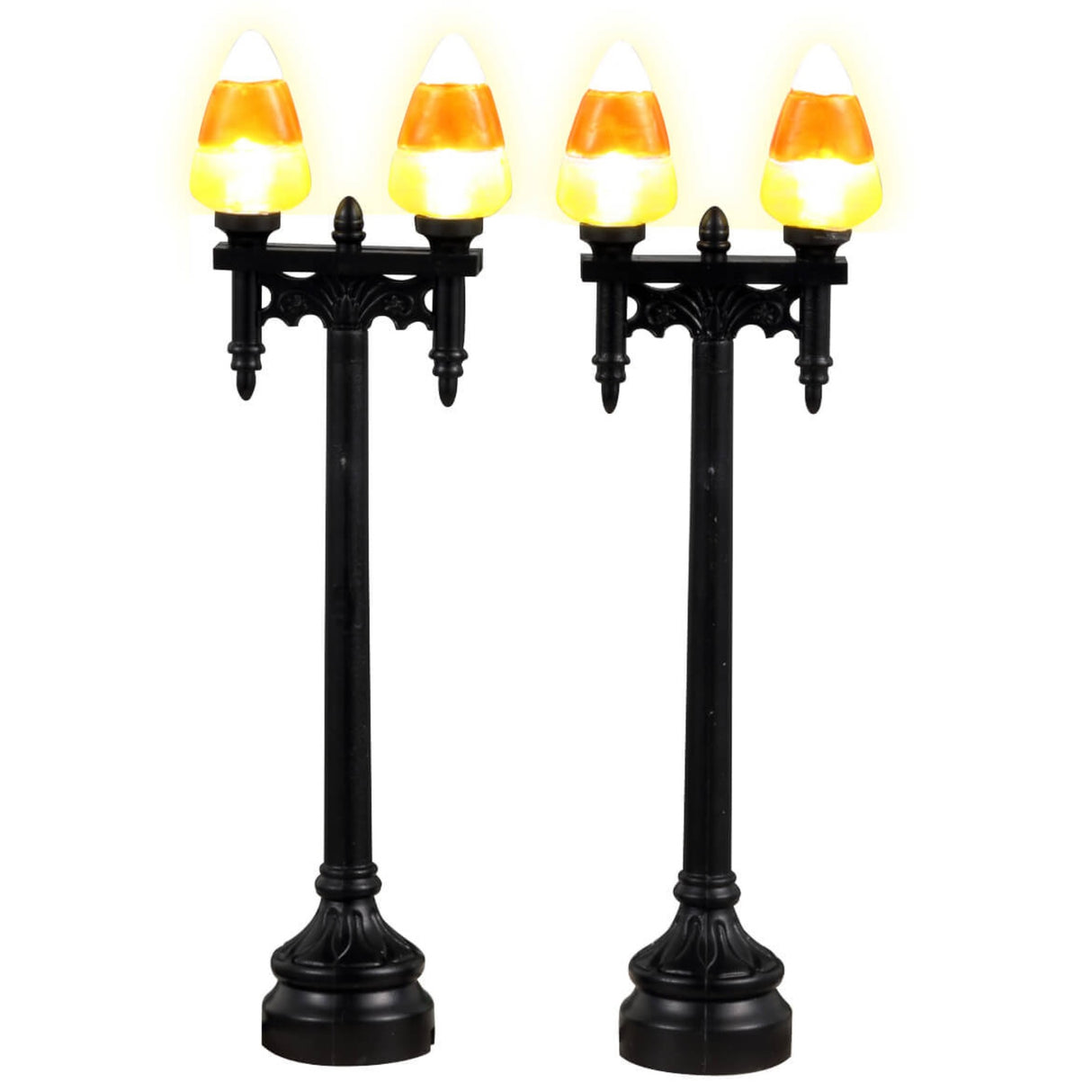 Plastic village accessories for a Lemax display. Designed to look like two shiny, black lampposts with candy corn shaped light bulb covers.