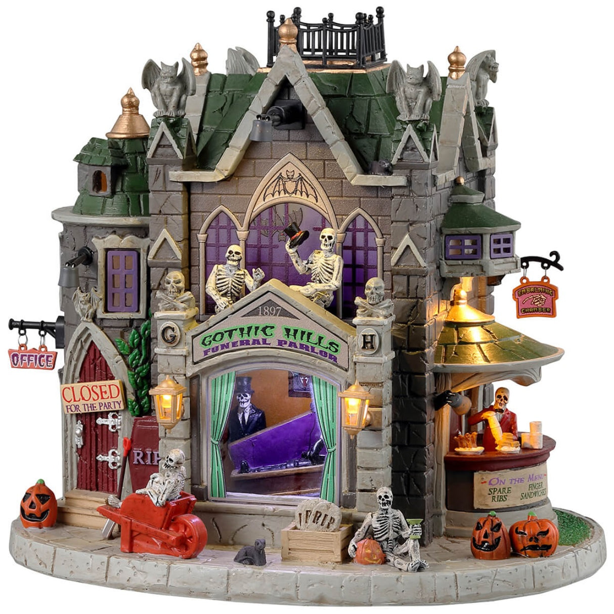 Resin lighted building for a Lemax display. Designed to look like a gothic castle. There are skeletons and skull accents, as well as gargoyles, pumpkins and rats. Inside the window you can see a skeleton testing out a coffin. Over to the right, there's a bar with a skeleton ready to serve you.