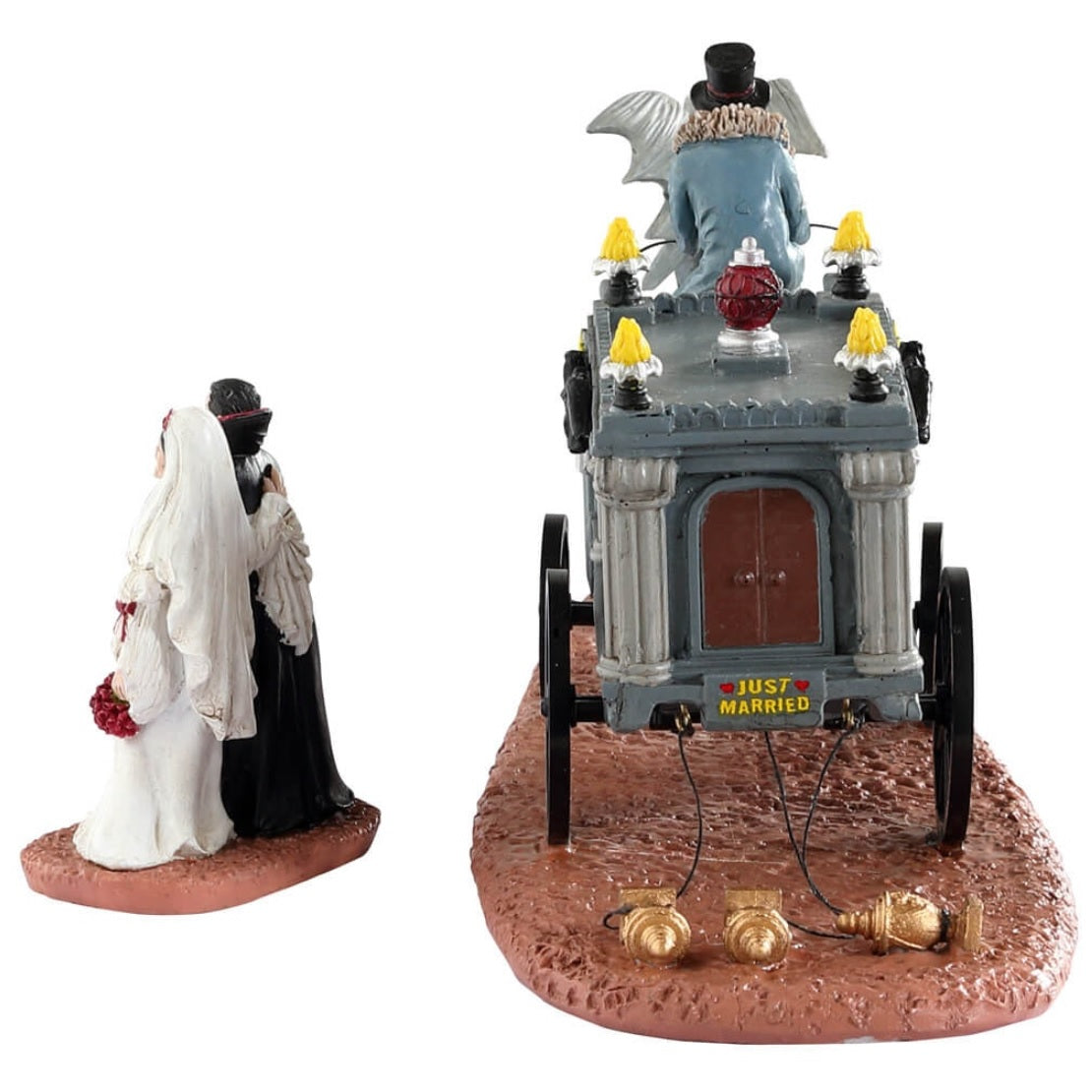 Resin table accent for a Lemax Spooky Town Village display. Designed to look like a wagon carrying a coffin. The wagon is being pulled by a horse with wings. There's a vampire couple that have just gotten married standing outside.