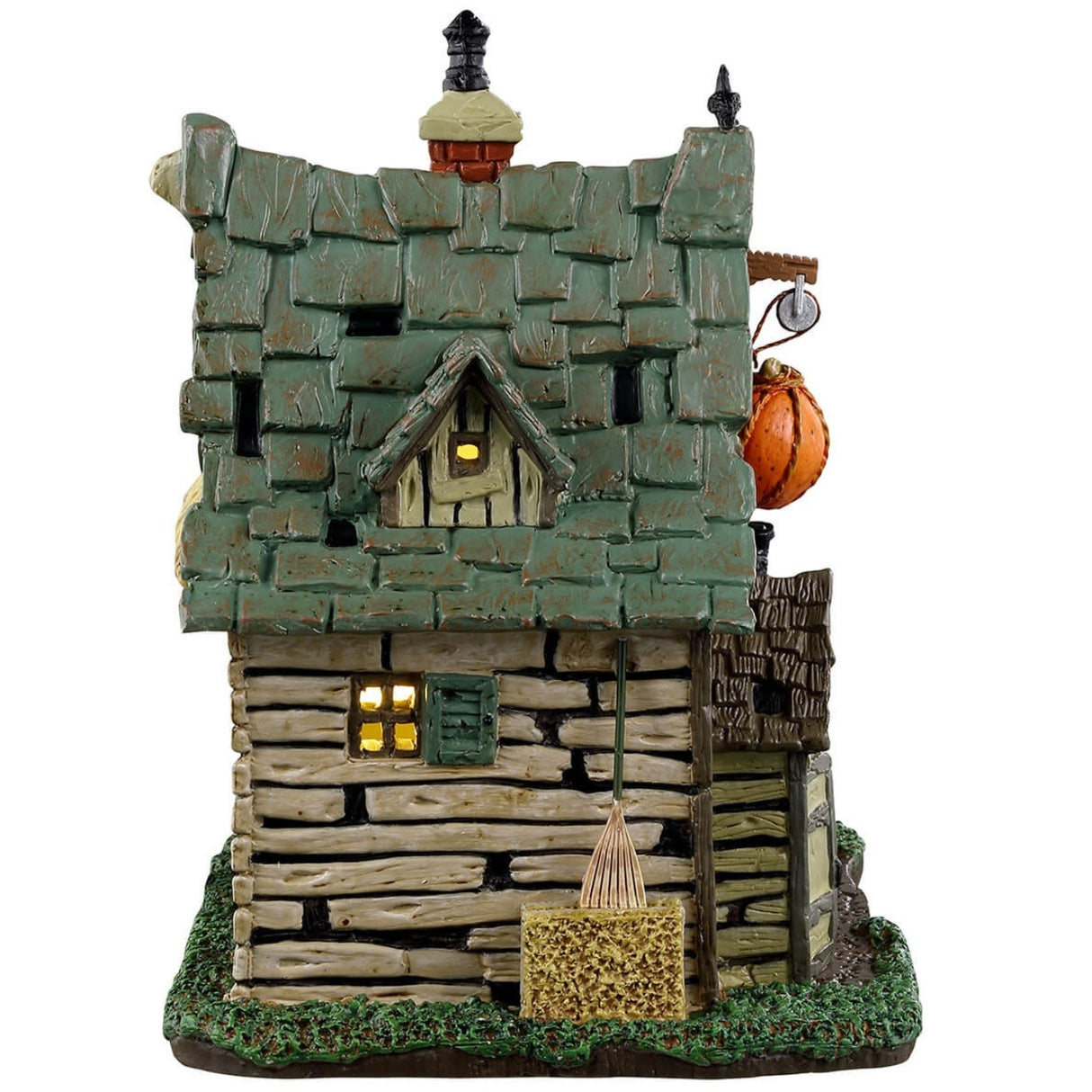 Porcelain lighted building for a Lemax display. Designed to look like a creepy cabin with bales of hay on the roof and on the columns holding it up. There's a skeleton sitting on the porch.