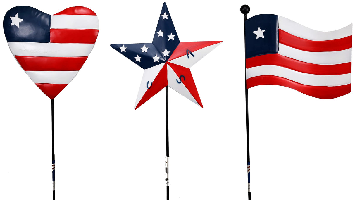 Patriotic outdoor garden stakes. One is shaped like a heart, one is shaped like a star and one is shaped like a flag. They're all red, white and blue and designed to look like the American flag.