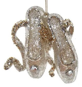 Glitter ornaments shaped like a pair of ballerina shoes.